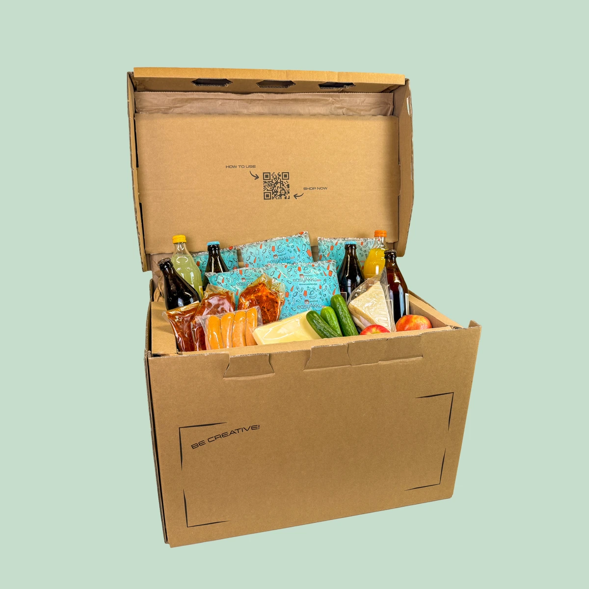 Kühlbox Maxi mit Inhalt auf mintgrünem Hintergrund